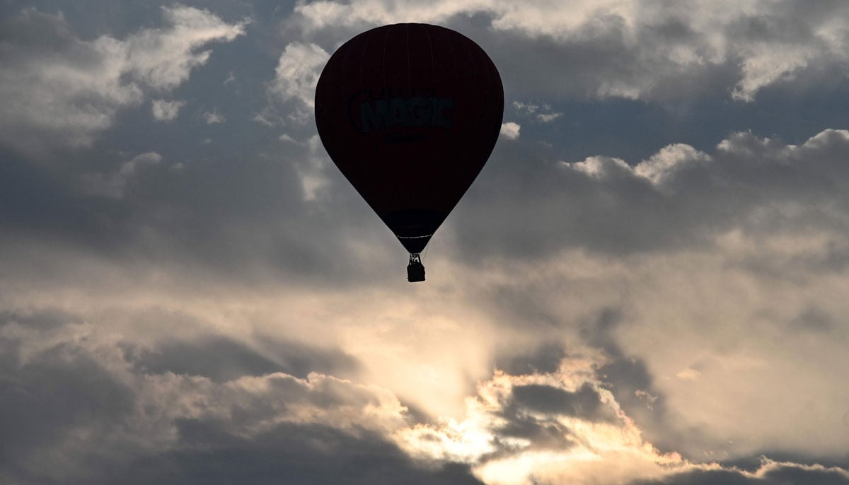 A hot air balloon rises in sky during the international festival at Pokhara in Nepal on December 25, 2024. — AFP